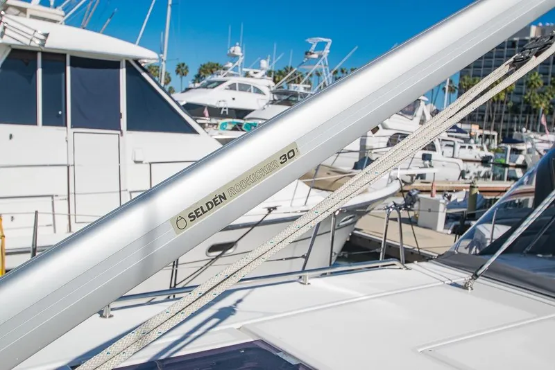 Slide: The Image of Bavaria C45 yacht with Selden Rodkicker 30, docked in a marina, 2021 model. - 86