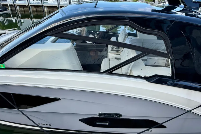 Slide: The Image of 2022 Sea Ray Sundancer 370 Outboard, sleek design, docked at marina. - 10