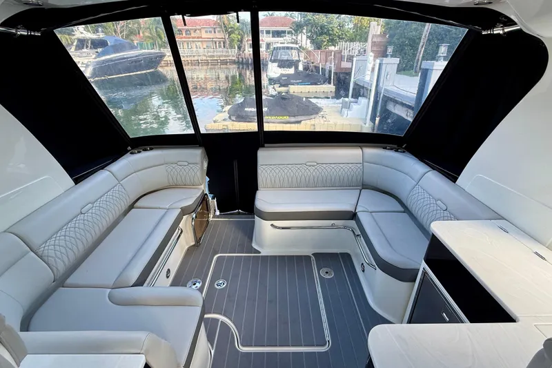 Slide: The Image of Luxurious interior of 2022 Sea Ray Sundancer 370 Outboard with elegant seating and waterfront view. - 14
