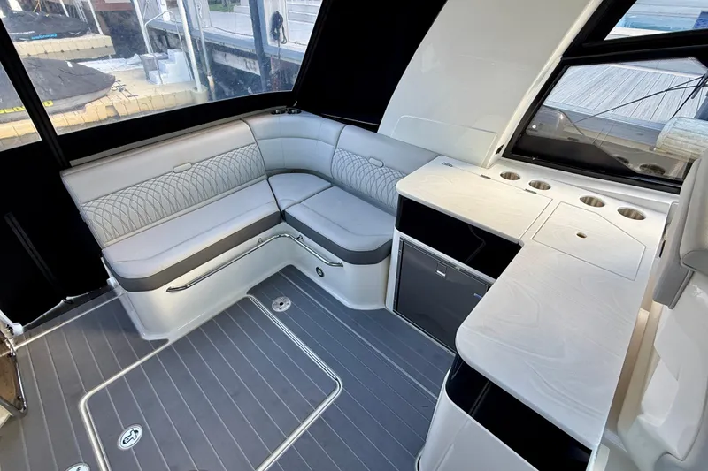Slide: The Image of Luxurious interior of 2022 Sea Ray Sundancer 370 Outboard with seating and kitchenette. - 16