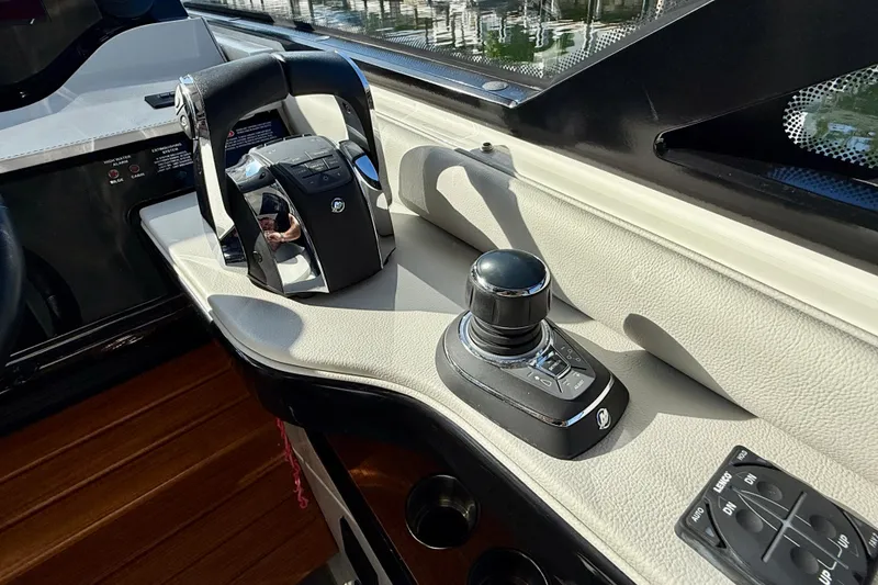 Slide: The Image of Control panel of 2022 Sea Ray Sundancer 370 Outboard, featuring joystick and throttle controls. - 24