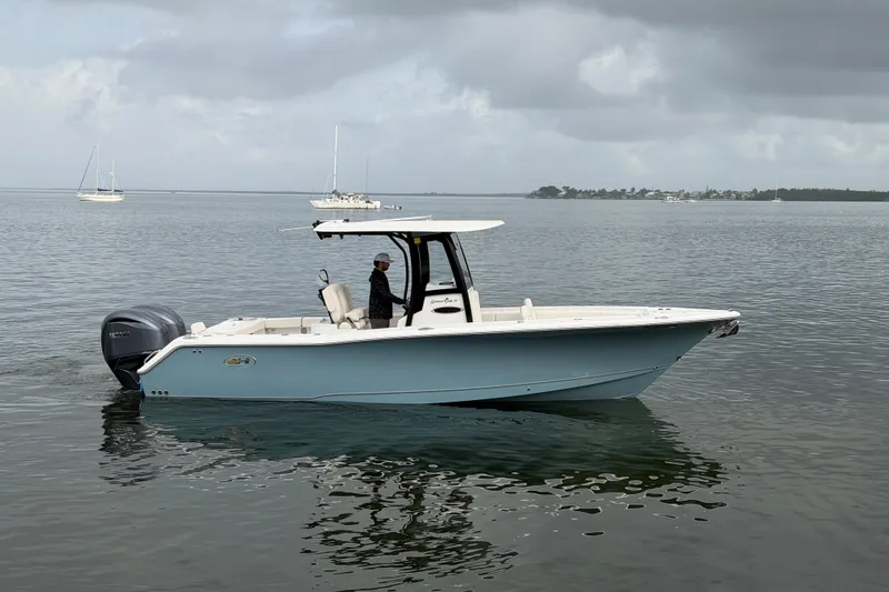 The Image of 2023 Sea Hunt Gamefish 27 boat on calm water, featuring forward seating. - 0
