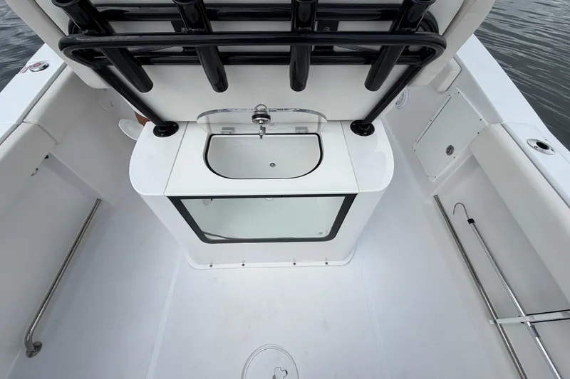 Slide: The Image of 2023 Sea Hunt Gamefish 27 Forward Seating boat interior with livewell and rod holders. - 12