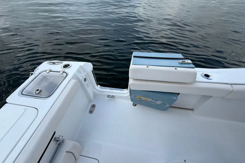 Slide: The Image of 2023 Sea Hunt Gamefish 27 boat interior with seating and water view. - 13