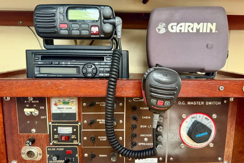 Slide: The Image of Control panel of a 1982 Catalina 30 sailboat with radio and Garmin GPS. - 25