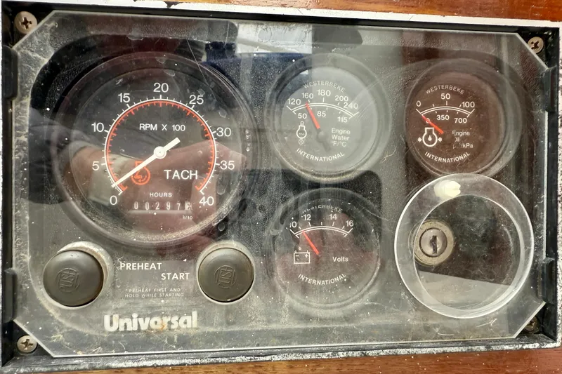 Slide: The Image of 1982 Catalina 30 engine control panel with tachometer and gauges. - 32