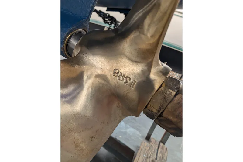 Slide: The Image of Close-up of a Catalina 30 sailboat propeller, model year 1982, with engraved markings. - 37