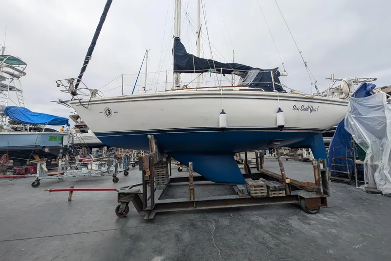 Slide: The Image of 1982 Catalina 30 sailboat on dry dock, named "Sea Said Yes!" - 39