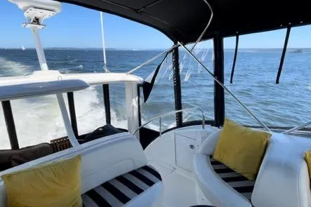 Slide: The Image of 2005 Meridian 368 Motoryacht interior with ocean view, featuring comfortable seating and stylish design. - 13