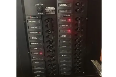 Slide: The Image of Electrical panel of 2005 Meridian 368 Motoryacht with labeled switches and indicators. - 15