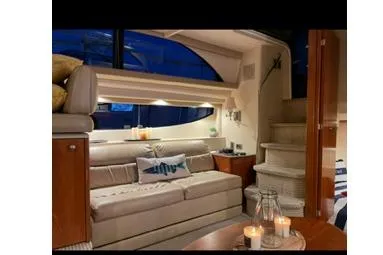 Slide: The Image of Luxurious interior of a 2005 Meridian 368 Motoryacht with cozy seating and ambient lighting. - 22