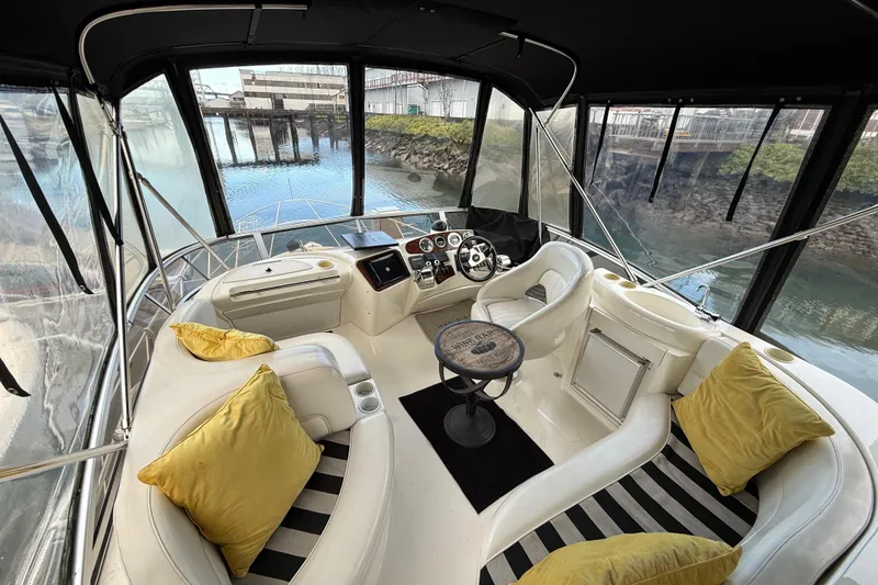Slide: The Image of Luxurious 2005 Meridian 368 Motoryacht interior with plush seating and scenic water view. - 37