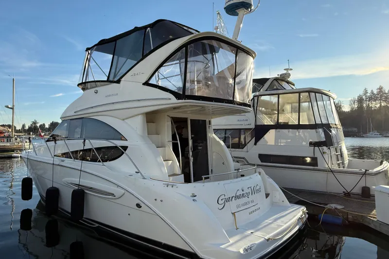 The Image of 2007 Meridian 341 Sedan yacht docked at marina under clear blue sky. - 0
