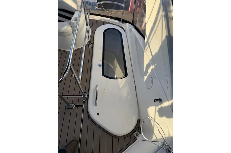 Slide: The Image of 2007 Meridian 341 Sedan yacht deck with sleek design and stainless steel railings. - 10