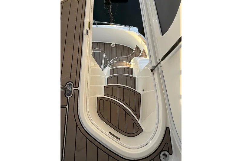 Slide: The Image of 2007 Meridian 341 Sedan boat interior with elegant wooden steps and sleek design. - 11