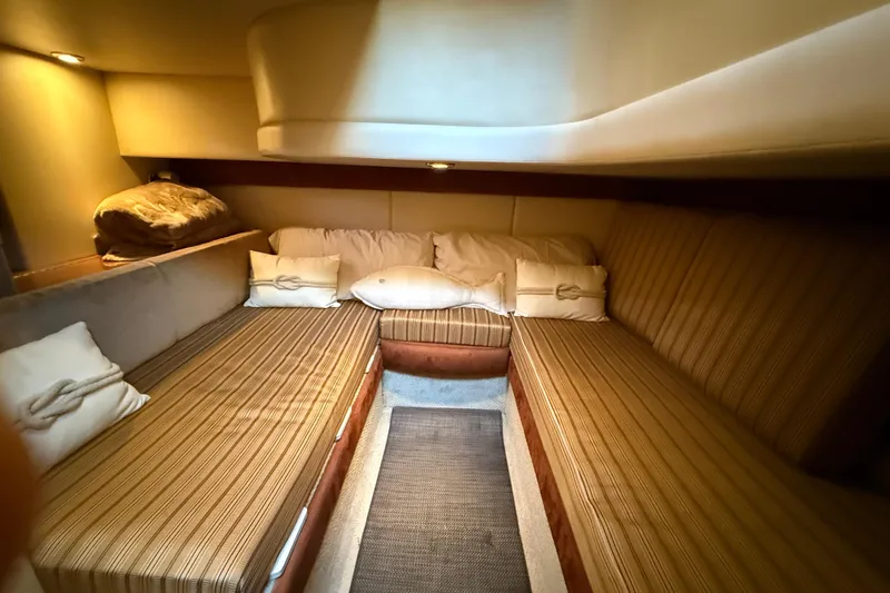 Slide: The Image of Cozy cabin interior of 2007 Meridian 341 Sedan with striped seating and soft lighting. - 13