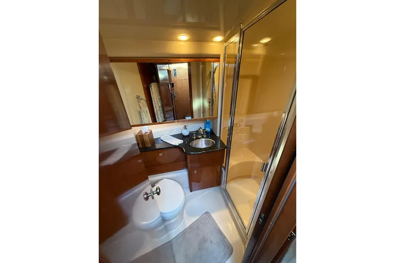 Slide: The Image of Luxurious bathroom in 2007 Meridian 341 Sedan yacht with modern fixtures and shower. - 14
