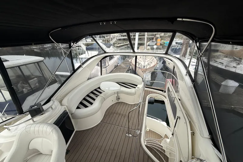 Slide: The Image of Luxurious interior of 2007 Meridian 341 Sedan yacht with elegant seating and marina view. - 16
