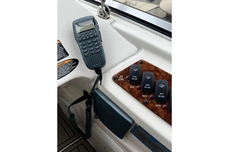 Slide: The Image of Control panel of a 2007 Meridian 341 Sedan with communication device and bilge switches. - 17