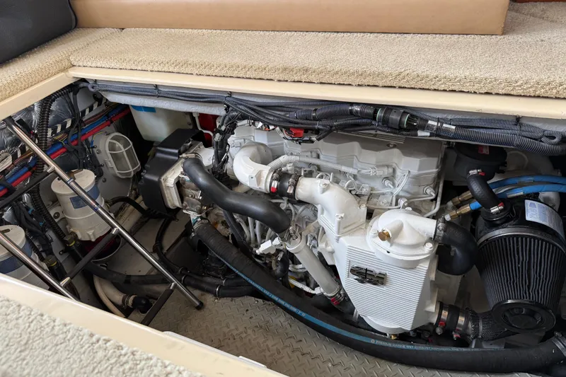 Slide: The Image of Engine compartment of a 2007 Meridian 341 Sedan boat, showcasing detailed mechanical components. - 21