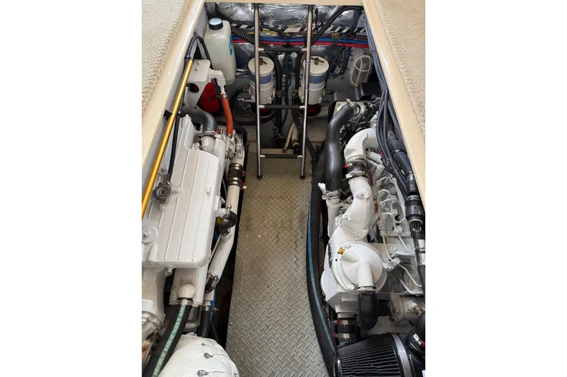 Slide: The Image of Engine compartment of a 2007 Meridian 341 Sedan, showcasing dual engines and mechanical components. - 24