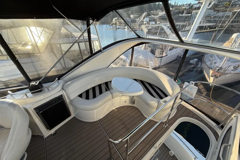Slide: The Image of Luxurious 2007 Meridian 341 Sedan yacht interior with elegant seating and scenic marina view. - 7
