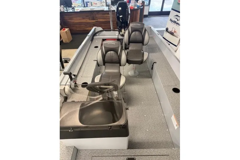Slide: The Image of 2026 Lund 1600 Fury SS boat interior with two seats and steering console. - 6