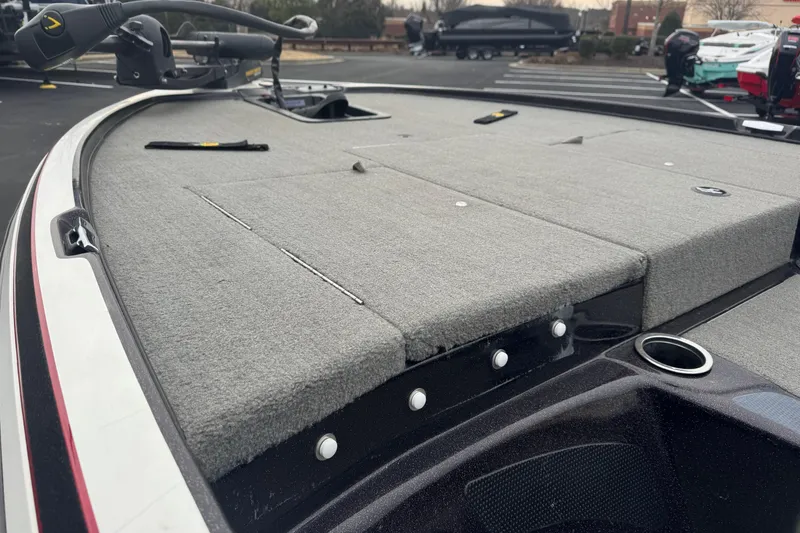 Slide: The Image of 2013 Nitro Z-6 boat deck with carpeted surface and fishing equipment. - 6