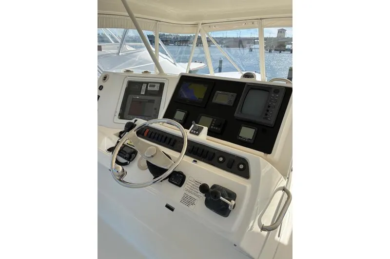 Slide: The Image of Satellite dome on 2004 Silverton 48 Convertible yacht under clear blue sky. - 10