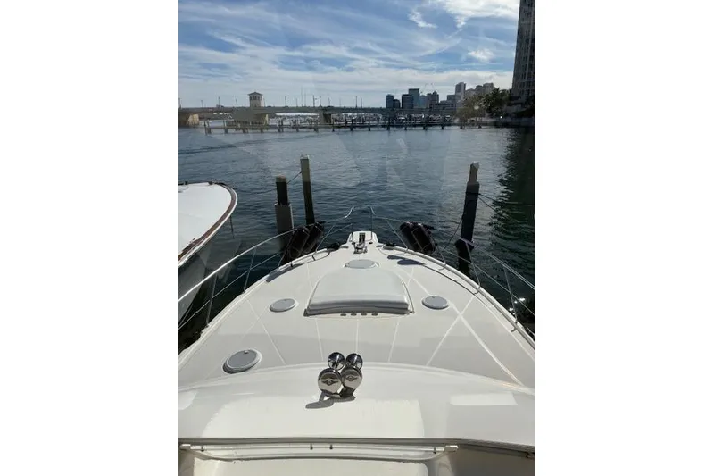 Slide: The Image of 2004 Silverton 48 Convertible yacht helm with navigation instruments and steering wheel. - 13