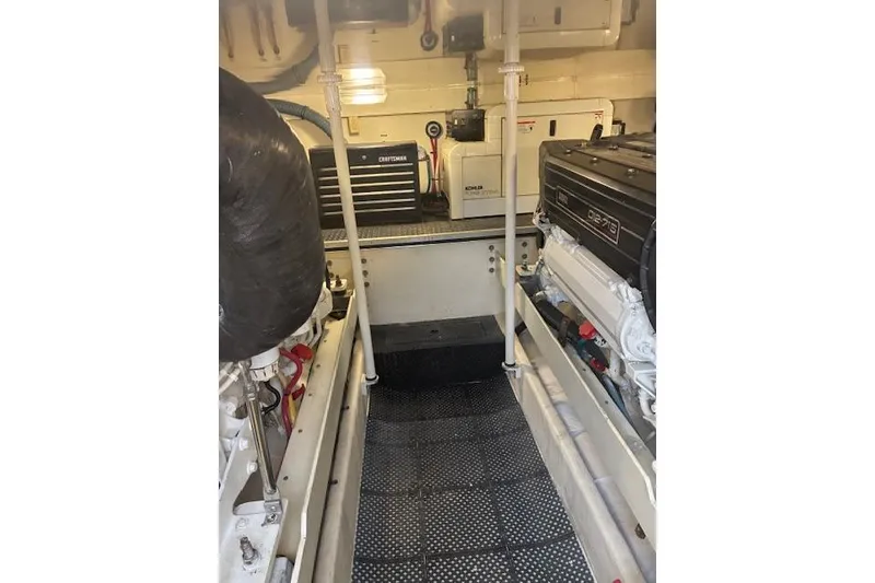 Slide: The Image of 2004 Silverton 48 Convertible yacht docked with city skyline in background. - 19