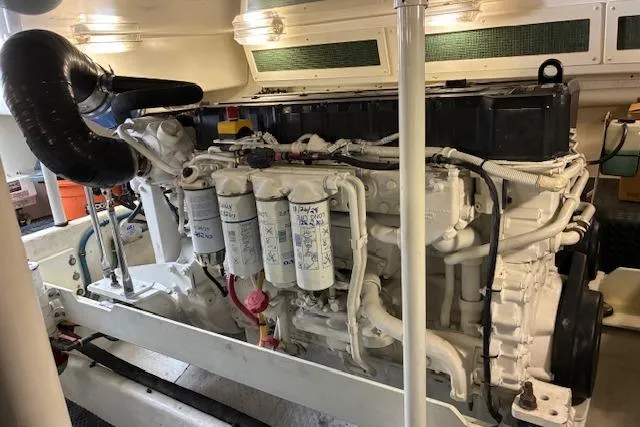 Slide: The Image of 2004 Silverton 48 Convertible yacht deck with anchor chain and winch. - 20