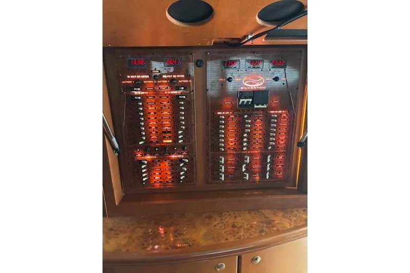 Slide: The Image of Engine room of a 2004 Silverton 48 Convertible yacht, featuring Volvo Penta engines. - 27