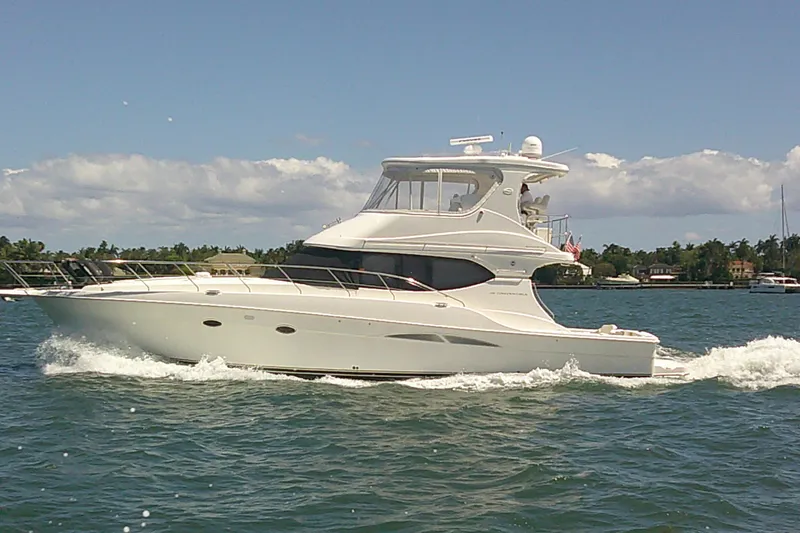 Slide: The Image of 2004 Silverton 48 Convertible yacht cruising on a sunny day. - 3