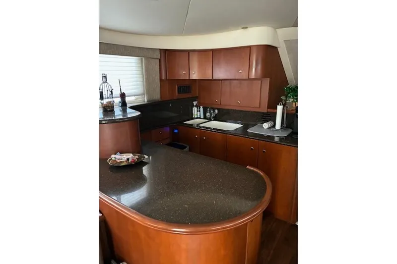 Slide: The Image of Engine compartment of a 2004 Silverton 48 Convertible boat, showing mechanical components. - 33