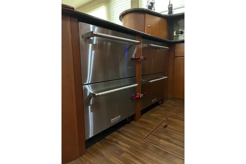 Slide: The Image of Engine room of 2004 Silverton 48 Convertible yacht with equipment and storage tank. - 34