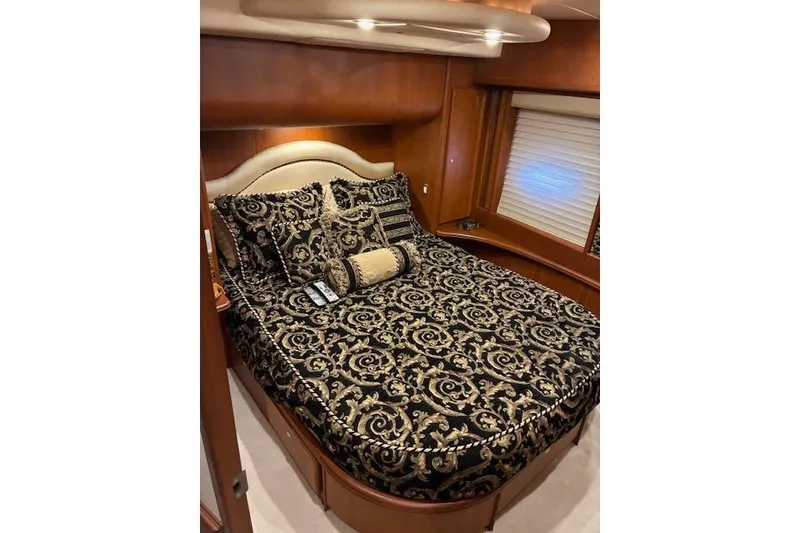 Slide: The Image of Interior of 2004 Silverton 48 Convertible yacht with stairs and seating area. - 51