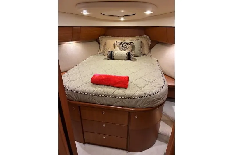 Slide: The Image of Luxurious bedroom interior of 2004 Silverton 48 Convertible yacht with elegant bedding. - 54