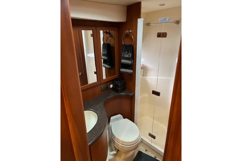 Slide: The Image of Bathroom interior of 2004 Silverton 48 Convertible yacht with shower and vanity. - 62