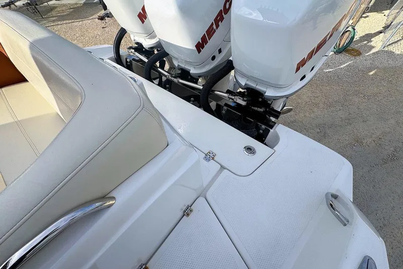 Slide: The Image of 2016 Nor-Tech 340 Sport Center Console with Mercury engines and white seating. - 11