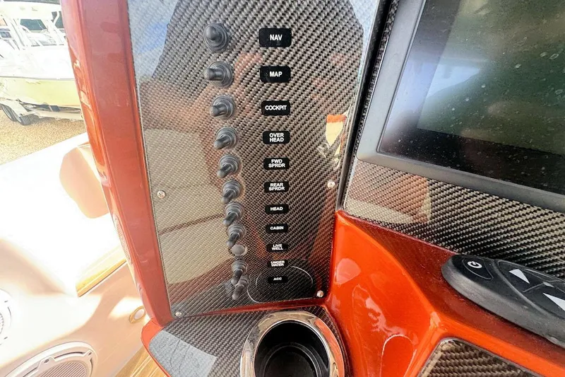 Slide: The Image of Control panel of 2016 Nor-Tech 340 Sport Center Console with carbon fiber finish. - 18