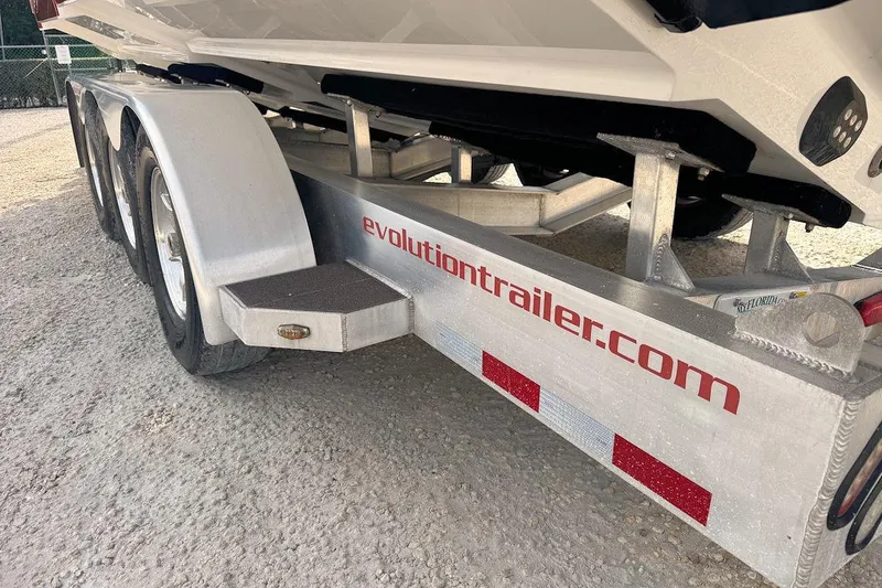 Slide: The Image of Trailer for 2016 Nor-Tech 340 Sport Center Console boat, featuring evolutiontrailer.com branding. - 6