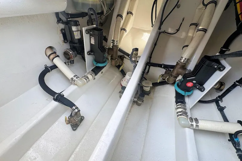 Slide: The Image of 2016 Nor-Tech 340 Sport Center Console boat plumbing and wiring system. - 7
