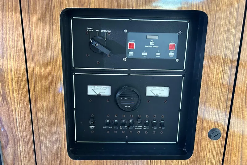 Slide: The Image of Electrical control panel on a 2008 Pursuit OS 315 Offshore boat. - 22