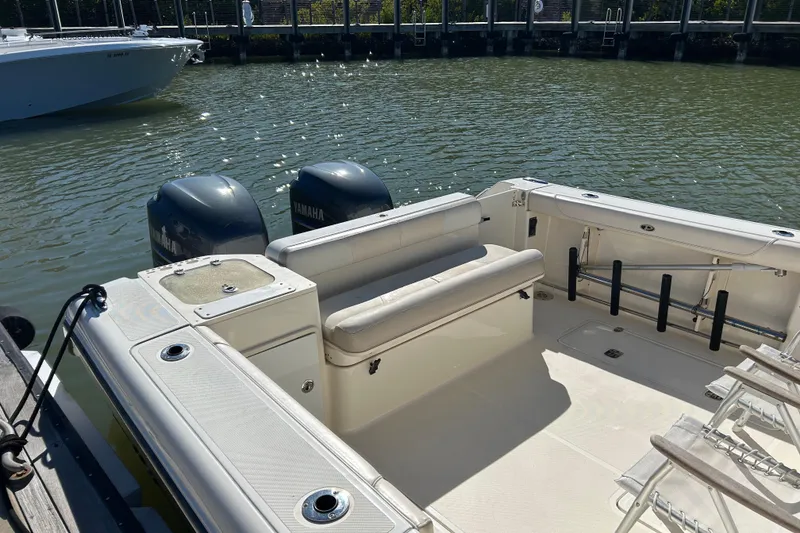 Slide: The Image of 2008 Pursuit OS 315 Offshore boat with Yamaha engines docked in a marina. - 5