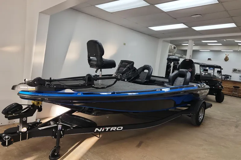 The Image of 2024 Nitro Z19 boat in showroom, featuring Minn Kota trolling motor. - 0
