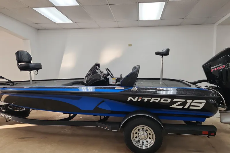 Slide: The Image of 2024 Nitro Z19 boat with sleek design and modern features in showroom. - 1