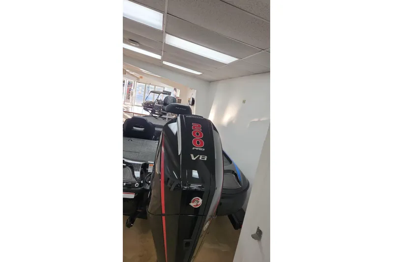 Slide: The Image of 2024 Nitro Z19 boat with powerful V8 engine in showroom. - 2