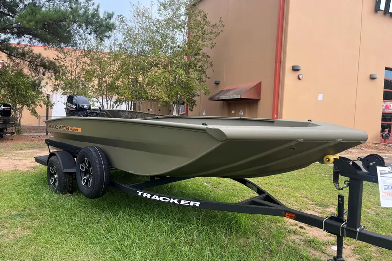 The Image of 2026 Tracker Grizzly 1756 T Marsh boat on trailer, parked outdoors. - 0