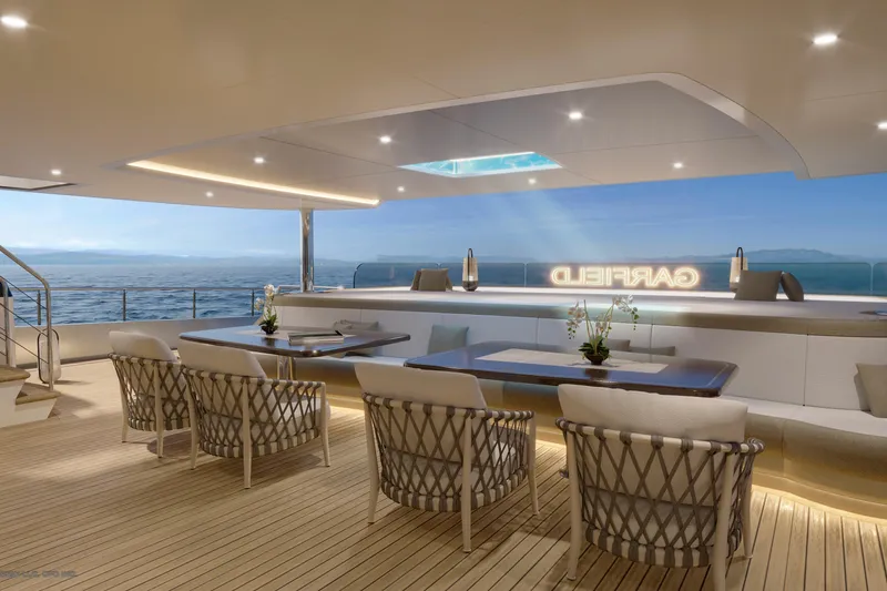 Slide: The Image of Luxurious yacht deck of Dynamic Project Garfield 2028, featuring elegant seating and ocean views. - 14
